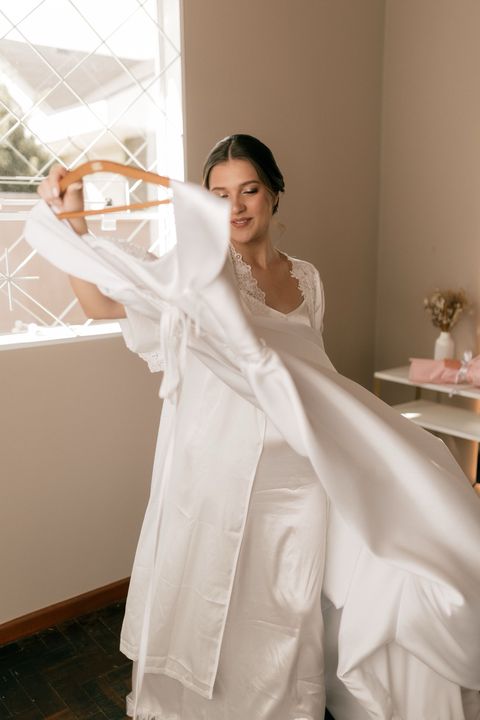 Woman holding a white wedding dress